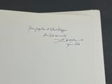 an open book with a handwritten poem on it sitting on top of a table