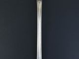 a spoon that is sitting on a black table