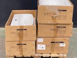 three boxes stacked on top of each other on a pallet