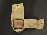 a small piece of cloth with a bottle inside of it