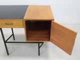 a close up of a small desk with a drawer open