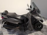 a motorcycle that is sitting on a checkered floor