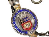 an image of a silver and blue necklace with a coat of arms