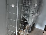 a metal cart that is sitting in the middle of a room
