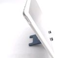 a white tablet computer sitting on top of a table