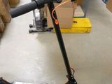 a scooter that is sitting on the floor in a room