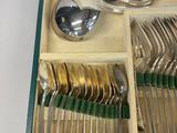 a box with silverware in it on a table