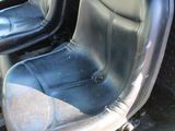 two black seats in the back of a truck