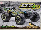 une boîte contenant un monster truck télécommandé