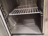 a small oven with a door open in a kitchen