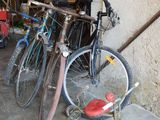two bikes parked next to each other in a garage