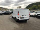 a white van that is parked in a parking lot
