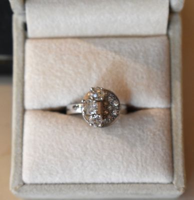 a ring that is sitting in a box on a table