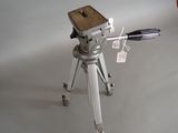 a camera on a tripod on a white background