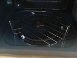 a close up view of an oven with a grill inside of it