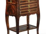 a small wooden table with a drawer on it