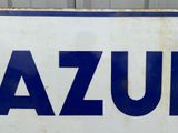 a picture of a blue and white sign that says azzura