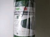 a roll of artificial grass wrapped in plastic on a table