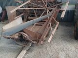 a pile of old machinery sitting in a garage