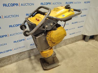 an image of a yellow and black machine on a stand