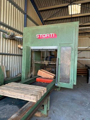 a machine that is working on a piece of wood