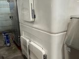an image of a refrigerator and a freezer in a room