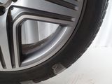 a close up of a tire on a white surface