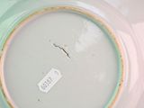 a plate with a tag on it sitting on a table
