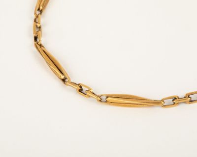 a gold link bracelet with a diamond clasp