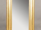 a gold framed mirror on a white background