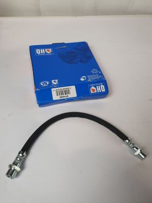 a close up of a hose on a table next to a blue box