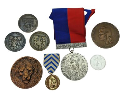 many medals and medals that are on a white surface