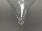 a wine glass that is sitting on a table