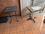 a small table that is on the floor in front of a window