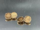 two gold coins sitting on top of each other
