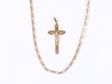 gold plated cross and chain necklace on a white background