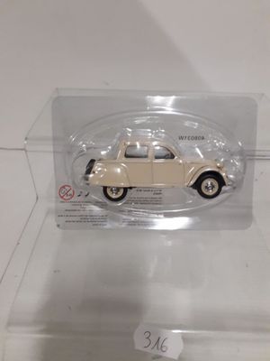 a toy car in a clear box on display