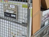 a metal cage with a bunch of boxes on top of it