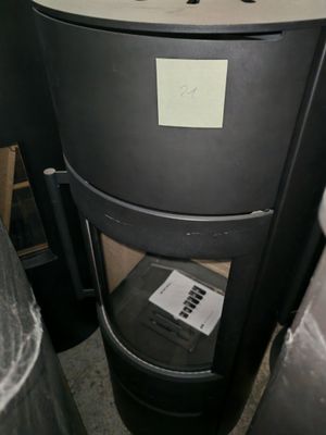 a black trash can sitting next to a black trash can