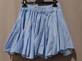a blue and white striped skirt hanging on a hanger