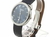 a watch with a blue dial on a black leather strap