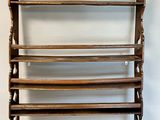 an image of a wooden rack with four shelves on it