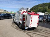 a white utility truck parked in a parking lot