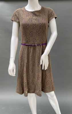 an image of a mannequin wearing a brown dress with a purple belt