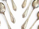 a lot of spoons and spoon spoons on a white surface
