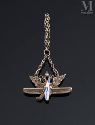 a silver necklace with an angel and a blue ribbon on a chain