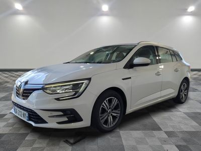 a white car is parked on a checkered tile floor