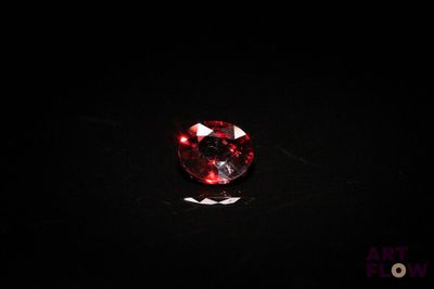 a red diamond on a black background