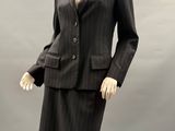 an image of a woman ' s suit and skirt on a mannequin