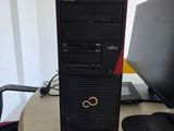a desktop computer sitting on top of a wooden desk